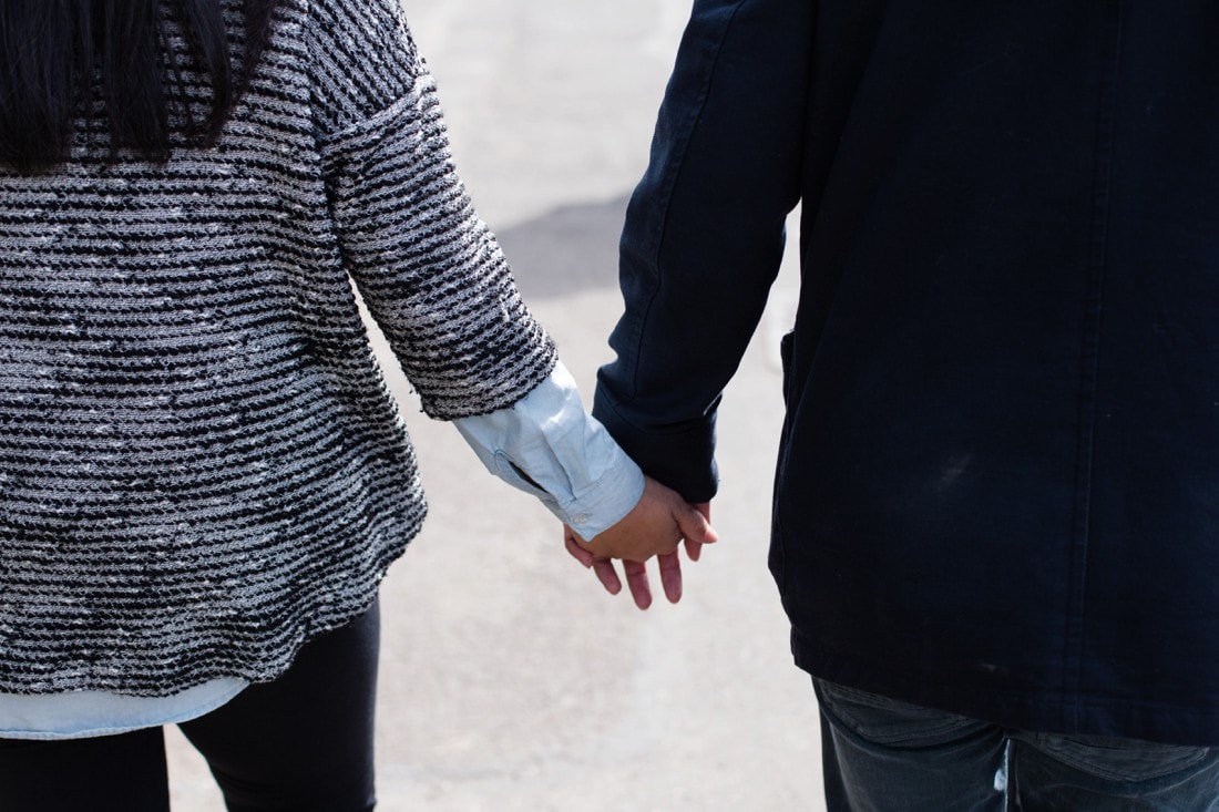 couple walking together holding hands